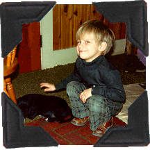 young Jeff pets dog
